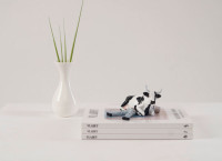 Статуэтка CowParade корова Sitting on Mant, 15×5×11 см Статуэтка CowParade корова Sitting on Mant, 15×5×11 см
